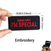 A black embroidered patch with red text that reads Mama Says I'm Special
