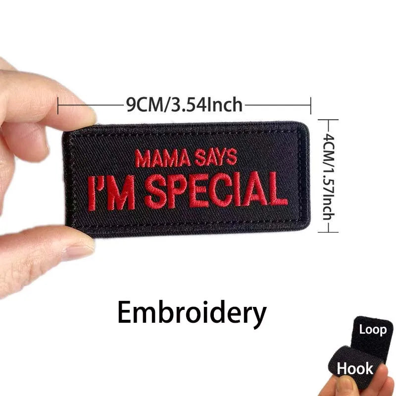 A black embroidered patch with red text that reads Mama Says I'm Special