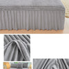 Gray plush bed skirt linen set featuring a textured fabric and a matching duvet cover.
