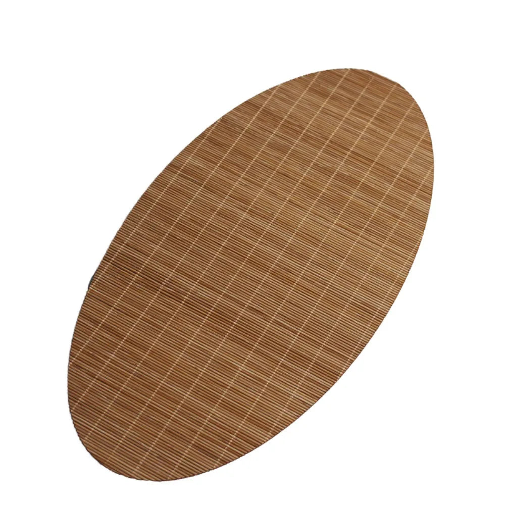 A round, brown bamboo tea mat with a fine vertical striped weave.