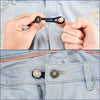 Hands are shown adjusting or using adjustable button extenders on denim fabric.