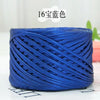Blue metallic cake yarn coiled for crafting