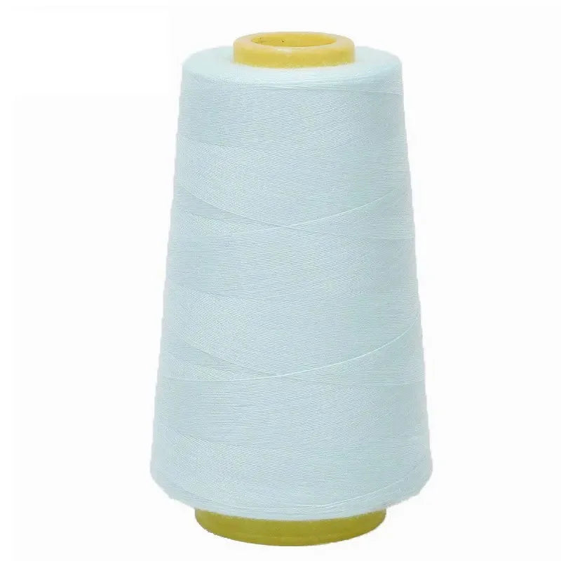 A white spool of premium sewing thread with a yellow core.