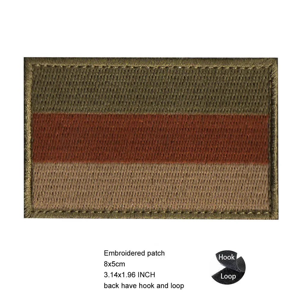 A rectangular embroidered patch featuring horizontal stripes of brown, red, and tan fabric.