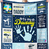A dark blue blanket featuring various text and handprints celebrating a dad.