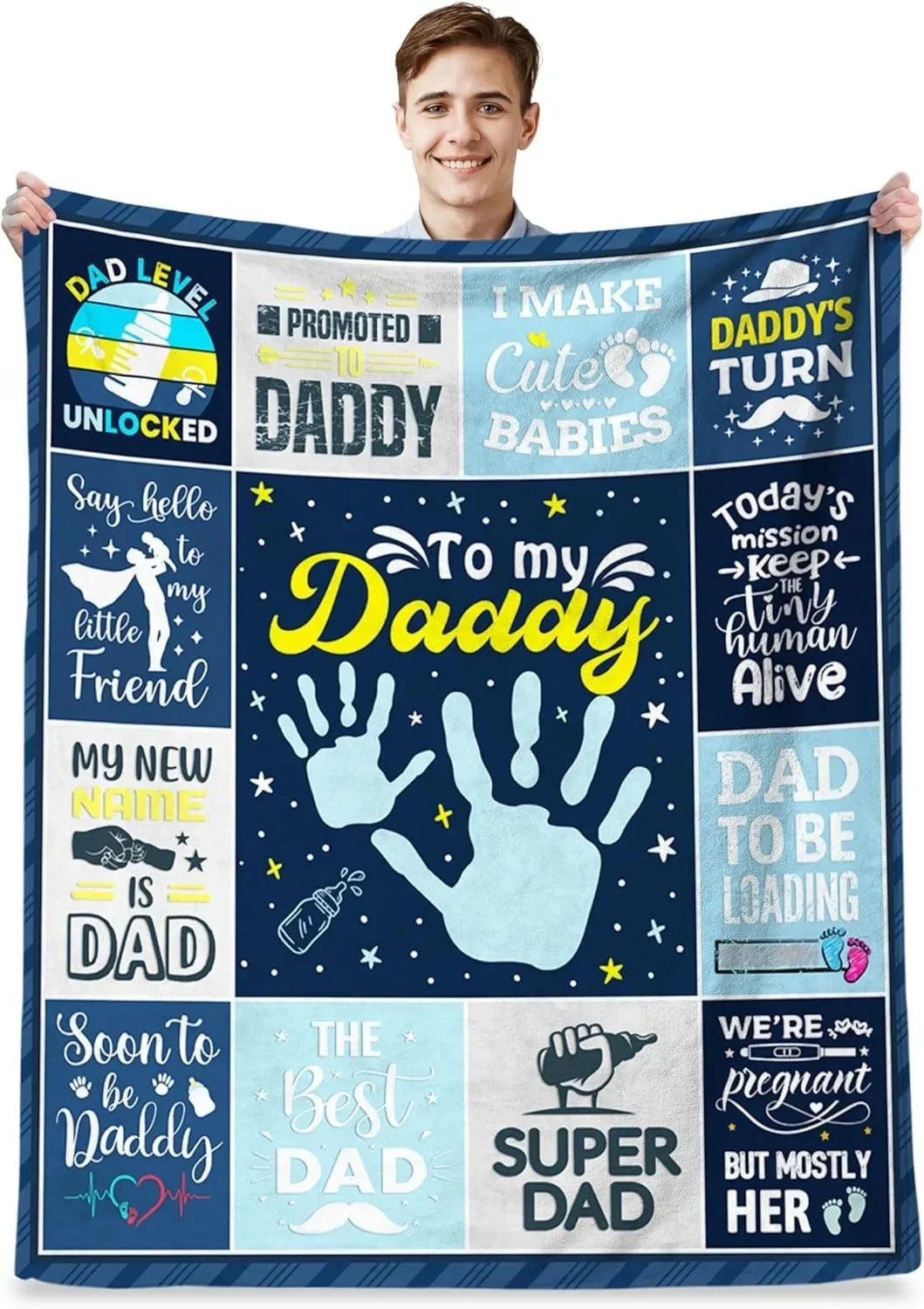 A dark blue blanket featuring various text and handprints celebrating a dad.