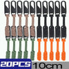 A set of 10 black zipper pull sliders with braided cord ends in various colors like beige, green, and orange.