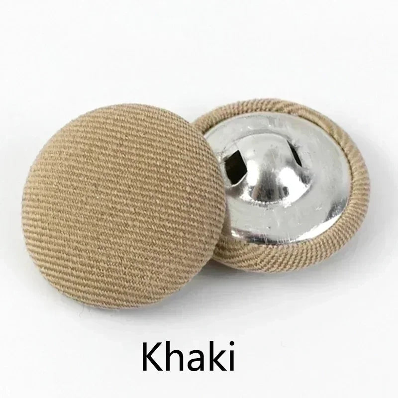 A set of round fabric-covered shank buttons in khaki color.