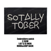 Black embroidered patch with the text SO TALLY TOBER in white thread.