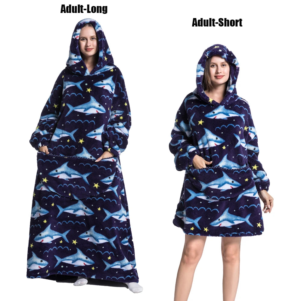 A woman models a navy blue and purple patterned plush fleece blanket hoodie for adults.