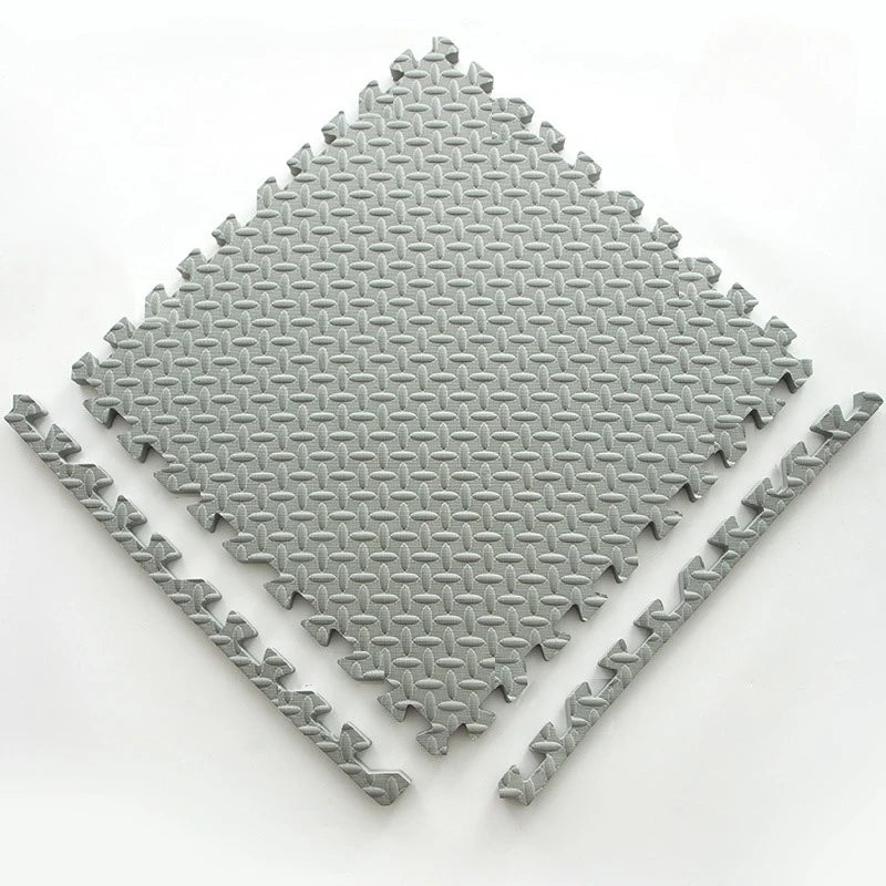 A square interlocking foam play mat with a diamond pattern, shown from above.