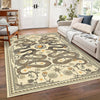 A beige area rug with a dark snake print and floral pattern in a living room setting.