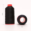 A black spool of heavy duty nylon sewing thread with a red cap and a circular view of the thread core.