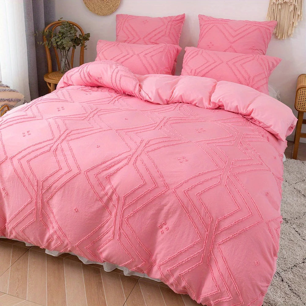 Pink bohemian grid tufted duvet cover set displayed on a bed.