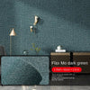 Dark green flax mo self-adhesive 3D thermal insulation wallpaper with linen texture on a wall.