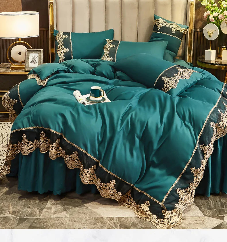 A teal bed skirt set featuring elegant gold lace trim and luxurious fabric on a bed.