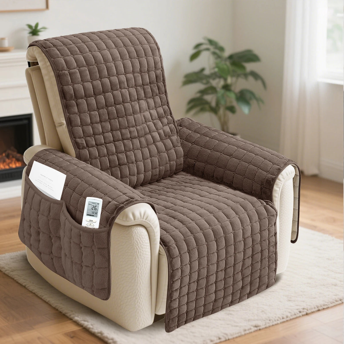 A brown washable recliner sofa slipcover with a quilted pattern and anti-slip strap resting on a light rug.