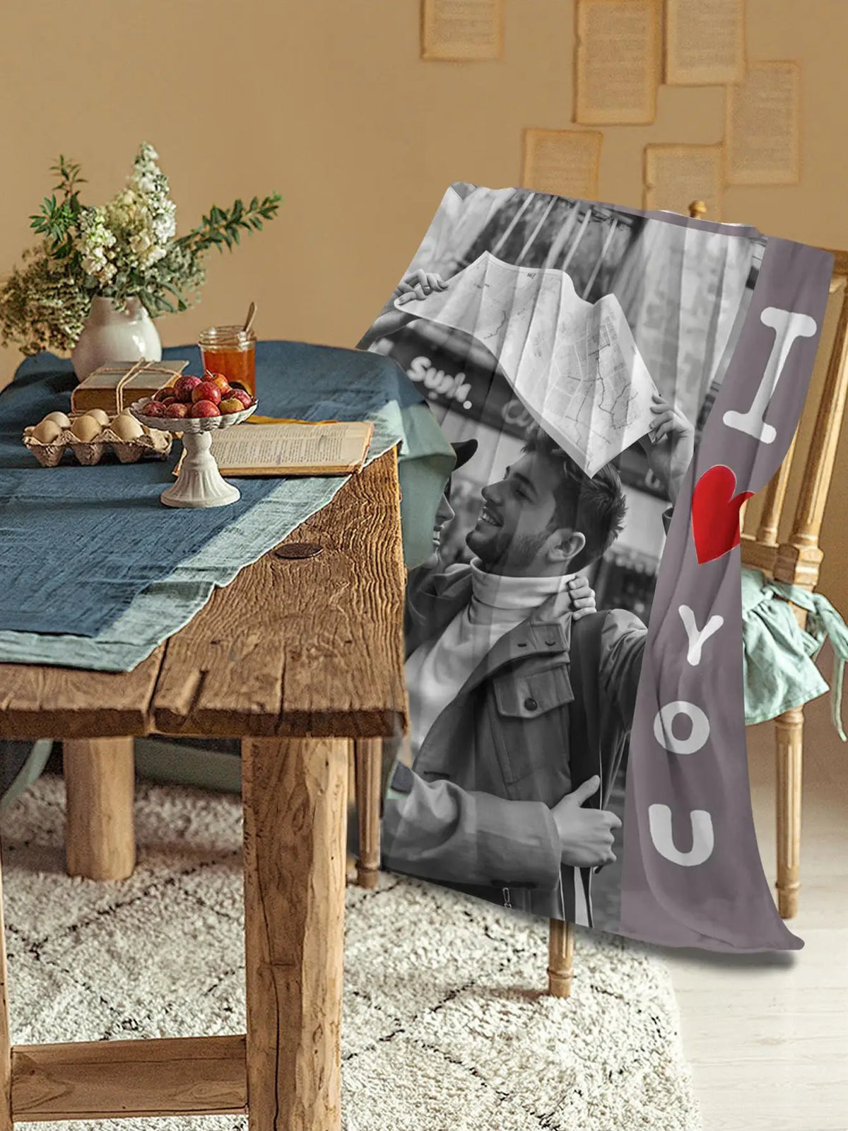 A personalized flannel blanket featuring a black and white photo of a man smiling.