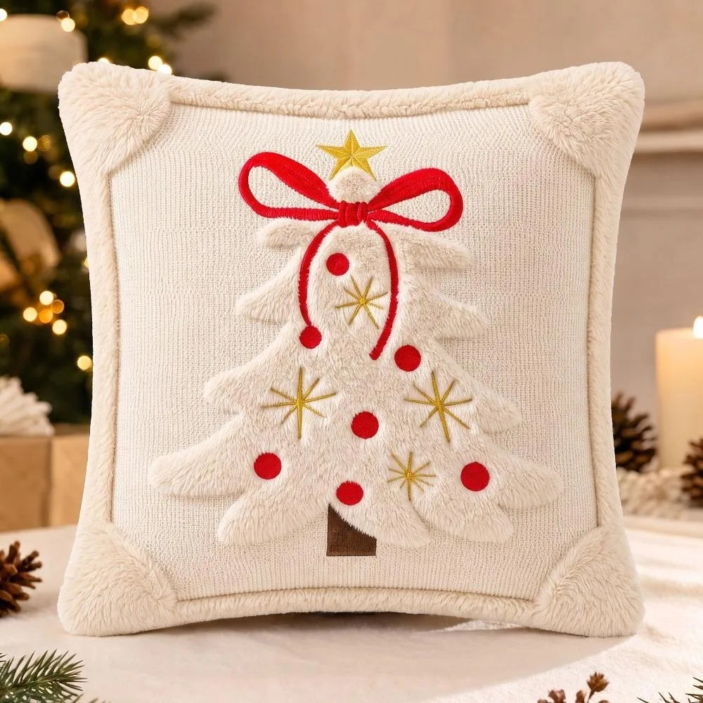 Cream embroidered velvet pillow cover shaped like a Christmas tree with a red bow and gold accents