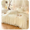 A luxurious cream princess chiffon duvet cover set displayed on a bed with sheer curtains and elegant decor.