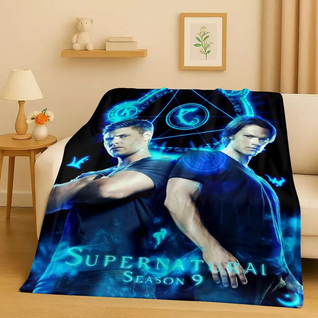 A dark blue and cyan graphic featuring characters from Supernatural Season 9 on a blanket.