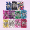 A collection of 100 colorful pearl head sewing pins in various colors and styles for dressmaking and DIY projects.