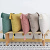 A row of boho cotton linen throw pillow covers in shades of sage green, mustard yellow, dusty rose, and gray.