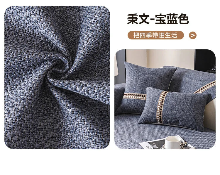 A close-up of a dark gray textured linen fabric used as a sofa cover, displayed in a living room setting.