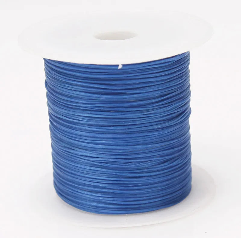 A spool of blue elastic beading cord on a white background.
