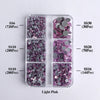 A plastic tray containing various sizes of light pink glass rhinestones in different quantities and colors.