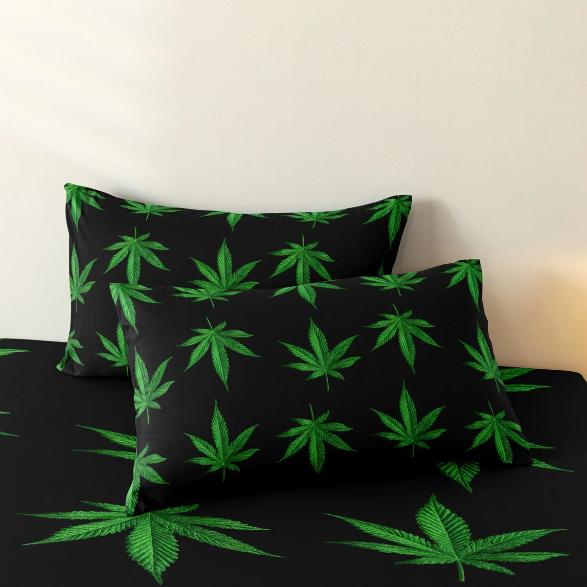 Black fitted sheet with a green cannabis leaf print