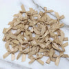 A collection of small, light beige satin ribbon bows for crafts and decor.