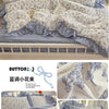 A light blue princess style bedding set featuring floral patterns and ruffled edges on a bed.