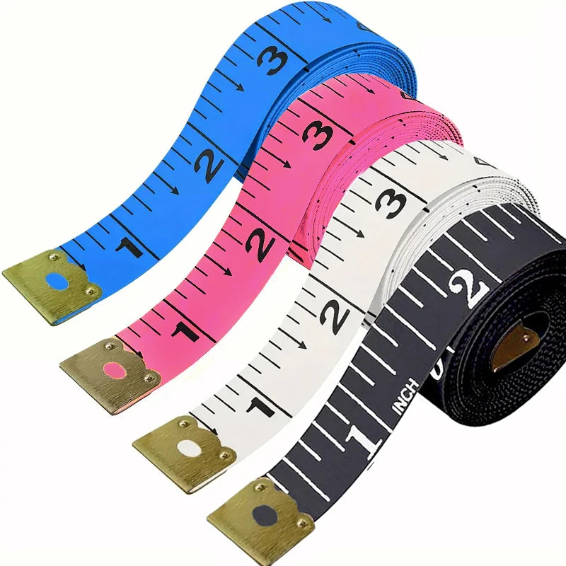 A set of two flexible body measuring tapes in blue, pink, and white, showing various inch markings.