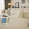 A beige plush elastic sofa cushion cover displayed on a light-colored sofa with neutral decor.