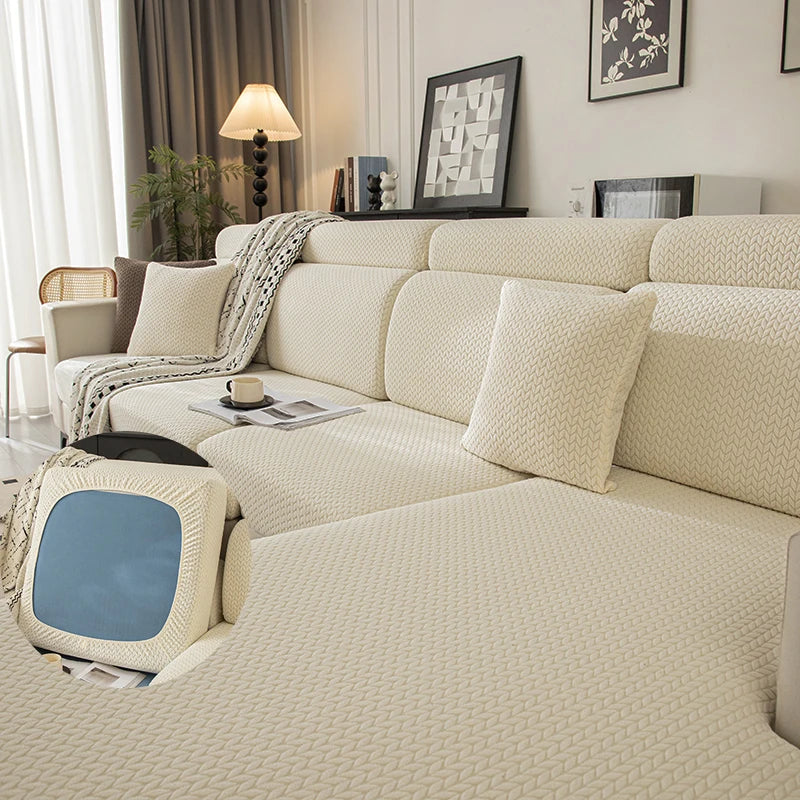 A beige plush elastic sofa cushion cover displayed on a light-colored sofa with neutral decor.