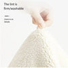 A hand is zooming in on the firm and washable white texture of a decor rug.