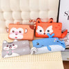 A collection of colorful memory foam neck pillows shaped like animals, including a fox, a panda, and a dolphin.