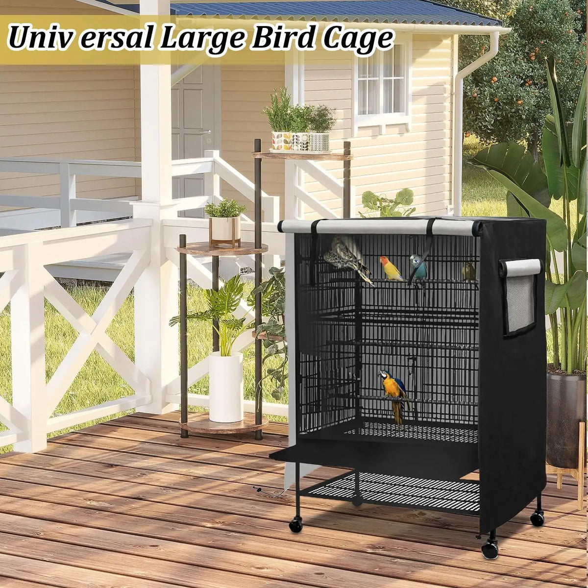 A black waterproof bird cage with a night cover is placed on a wooden deck next to a house.