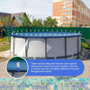 A large, round pool cover is secured with heavy-duty stainless steel clips against the elements.