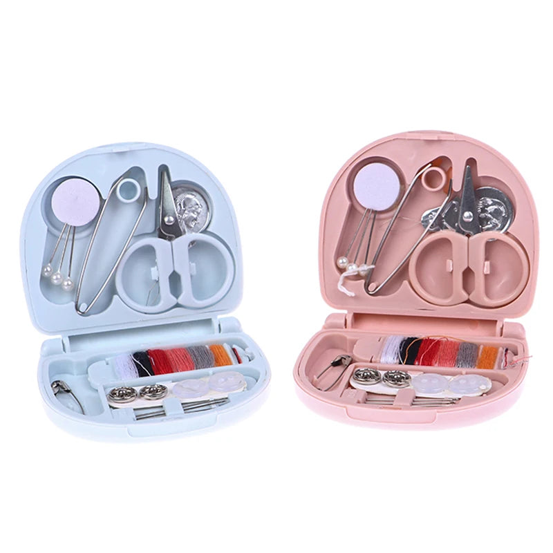 A pink portable DIY sewing box containing various sewing tools and needles for home crafts.