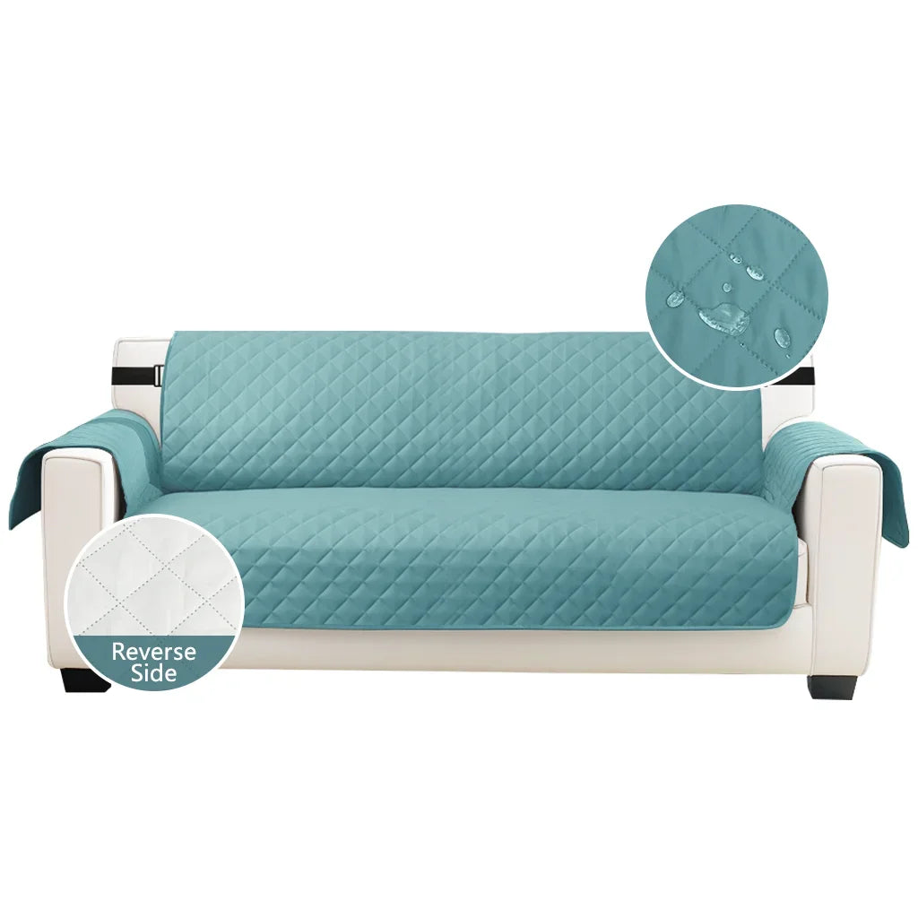 Light blue quilted sofa slipcover shown with a circular inset detailing the reverse side.