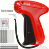A red Stitch Gun clothing repair tool with a black handle and various needle boxes for sewing and repair.