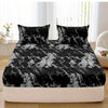 Black and white marble print fitted sheet set with pillowcases on a bed