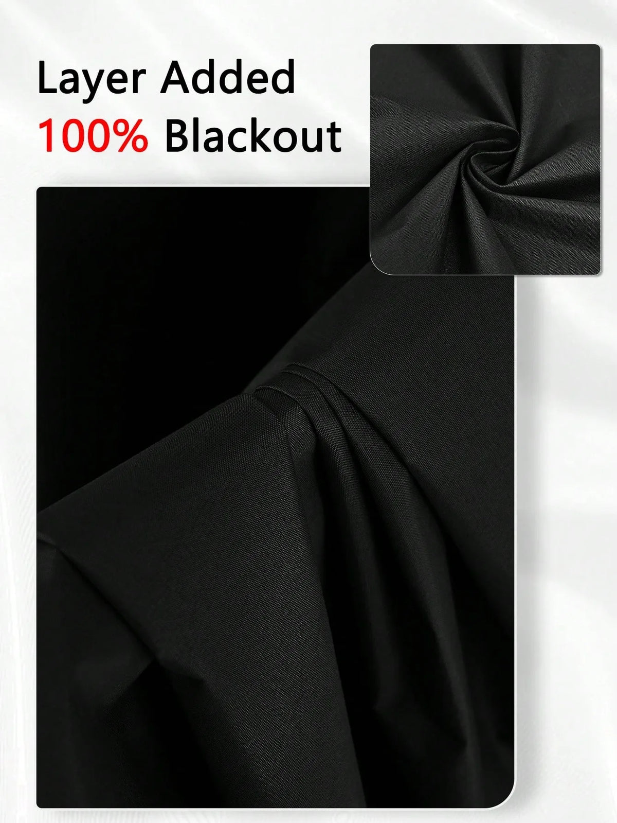 A close-up of black blackout window curtains showing the fabric texture and gathered folds.