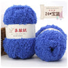 A stack of bright blue soft coral velvet yarn balls for crafting with a label indicating 24 strands.