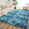 A rectangular blue shaggy rug placed on a wooden floor in a bright living room setting.