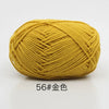A ball of golden yellow organic cotton 4ply knitting yarn for crafts.