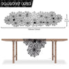 Black lace spider web table runner displayed on a wooden table.