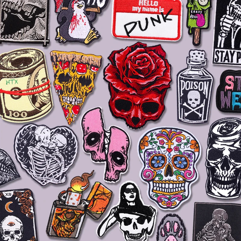 A collection of embroidery patches featuring skulls, roses, and punk themes for clothing.